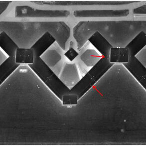 An image of an aerial infrared survey of a building, detailing areas of roof moisture.